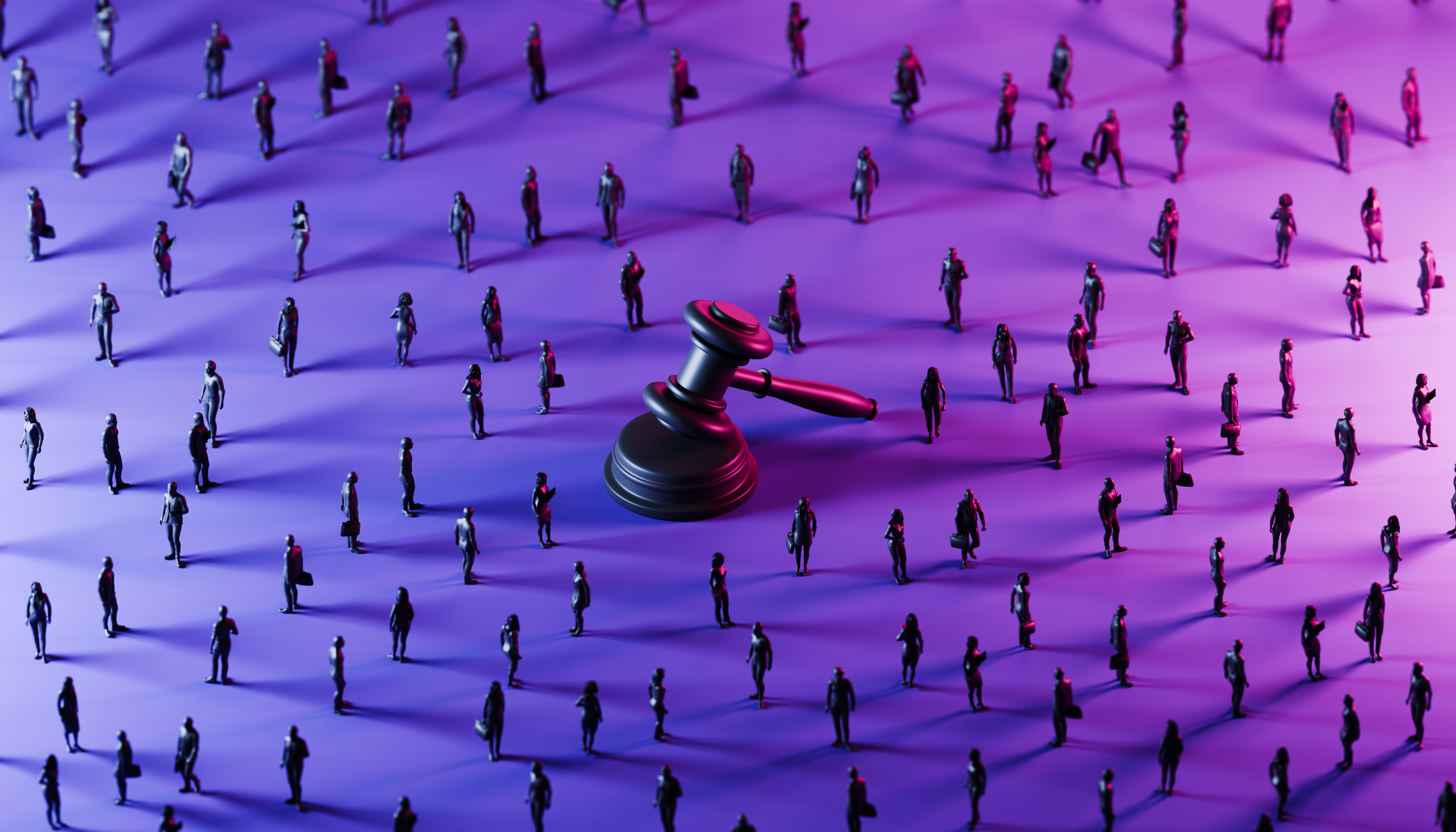 Judge's Gavel surrounded by miniatures of people